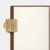 Traveler's Company | Clip Brass Traveler Logo